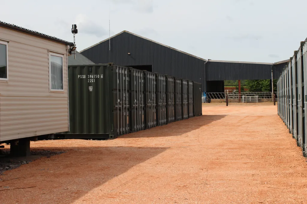 View of security camera watching row of shipping containers