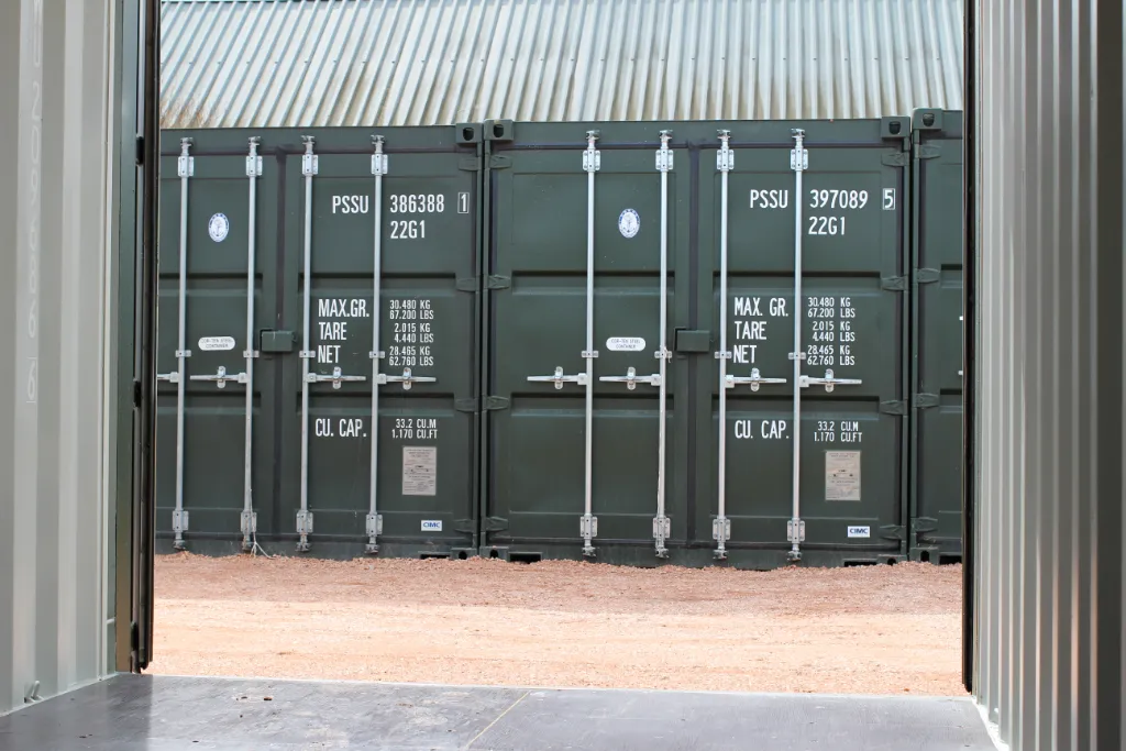 View of opposite storage containers from inside shipping container